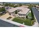Stunning aerial view of a large single-story home with a well-manicured lawn and a three-car garage at 4208 Agosta Luna Pl, Las Vegas, NV 89135