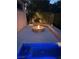 Outdoor fire pit with pavers and a small outdoor spa provides a space for relaxation at 4208 Agosta Luna Pl, Las Vegas, NV 89135