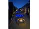 Backyard at night featuring a fire pit, spa, and patio furniture at 4208 Agosta Luna Pl, Las Vegas, NV 89135