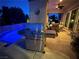 Backyard view with a built in barbecue near a covered patio and inviting pool at 4208 Agosta Luna Pl, Las Vegas, NV 89135