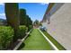 Turf backyard area with seating, landscaping, and a serene outdoor setting at 4208 Agosta Luna Pl, Las Vegas, NV 89135