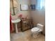 Cozy powder room with pedestal sink, decorative mirror, and neutral decor at 4208 Agosta Luna Pl, Las Vegas, NV 89135