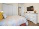 Relaxing bedroom featuring a comfortable bed, a large closet, and a view to another room at 4208 Agosta Luna Pl, Las Vegas, NV 89135