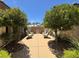 Beautifully landscaped courtyard with seating area, offering a serene outdoor space at 4208 Agosta Luna Pl, Las Vegas, NV 89135
