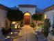 Inviting courtyard with comfortable seating and lush landscaping provides a relaxing outdoor space at 4208 Agosta Luna Pl, Las Vegas, NV 89135