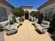 Inviting courtyard with comfortable seating and lush landscaping provides a relaxing outdoor space at 4208 Agosta Luna Pl, Las Vegas, NV 89135