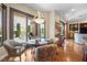 This dining area features floor-to-ceiling windows and a decorative chandelier at 4208 Agosta Luna Pl, Las Vegas, NV 89135