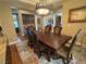 Stylish dining room with a spacious wooden table and decorative chandelier at 4208 Agosta Luna Pl, Las Vegas, NV 89135