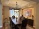 Tastefully decorated dining room with a large table and elegant window treatments at 4208 Agosta Luna Pl, Las Vegas, NV 89135