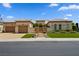 Charming single-story home featuring a courtyard, manicured landscaping, and a three-car garage at 4208 Agosta Luna Pl, Las Vegas, NV 89135