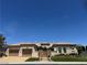 Stunning single-story home features a landscaped front yard, three-car garage and inviting curb appeal at 4208 Agosta Luna Pl, Las Vegas, NV 89135