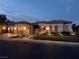 Charming single-story home featuring a three-car garage and well-lit landscaping at 4208 Agosta Luna Pl, Las Vegas, NV 89135