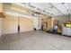 Spacious garage featuring built-in storage cabinets and epoxy flooring at 4208 Agosta Luna Pl, Las Vegas, NV 89135