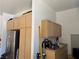 A well organized garage features built in storage cabinets and a refrigerator at 4208 Agosta Luna Pl, Las Vegas, NV 89135
