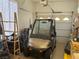 Garage with a golf cart and storage racks and a door to the house at 4208 Agosta Luna Pl, Las Vegas, NV 89135