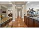 Spacious hallway with hardwood floors leading to the kitchen and other areas at 4208 Agosta Luna Pl, Las Vegas, NV 89135