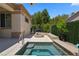 Relaxing backyard hot tub surrounded by lush greenery, providing a private and serene escape at 4208 Agosta Luna Pl, Las Vegas, NV 89135