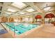 Spacious indoor pool with skylights and ample natural light, perfect for year-round swimming and relaxation at 4208 Agosta Luna Pl, Las Vegas, NV 89135