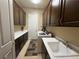 Functional laundry room with ample storage cabinets and modern appliances at 4208 Agosta Luna Pl, Las Vegas, NV 89135