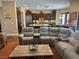 Spacious living room with a seamless flow to the kitchen, featuring comfortable seating at 4208 Agosta Luna Pl, Las Vegas, NV 89135