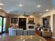Spacious living room with a cozy fireplace, built-in shelving, and lots of natural light at 4208 Agosta Luna Pl, Las Vegas, NV 89135