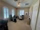 Bright home office with arched windows, ceiling fan, and office equipment at 4208 Agosta Luna Pl, Las Vegas, NV 89135
