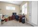 Office space featuring dark wood desk, rolling chair and storage boxes at 4208 Agosta Luna Pl, Las Vegas, NV 89135