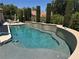 Relaxing pool area with lush landscaping, offering a serene escape for swimming and outdoor enjoyment at 4208 Agosta Luna Pl, Las Vegas, NV 89135