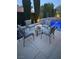 Outdoor patio seating area near a pool, perfect for relaxing and entertaining guests at 4208 Agosta Luna Pl, Las Vegas, NV 89135