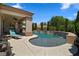 Inviting backyard pool with spa and water feature complemented by a covered patio for outdoor relaxation at 4208 Agosta Luna Pl, Las Vegas, NV 89135