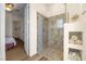 Modern walk-in shower with stylish tile work and convenient built-in storage shelves at 4208 Agosta Luna Pl, Las Vegas, NV 89135