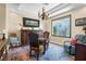 Sitting room with hardwood floors, a textured window, and stylish decor at 4208 Agosta Luna Pl, Las Vegas, NV 89135
