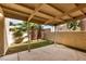 Spacious back patio featuring a covered area and beautiful landscaping, perfect for outdoor entertaining at 4213 Essex Green Ct, Las Vegas, NV 89110
