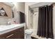 Modern bathroom features updated fixtures, a vanity with storage, and a shower/tub combo at 4213 Essex Green Ct, Las Vegas, NV 89110