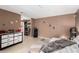 Spacious bedroom featuring a large bed, modern décor and a walk-in closet at 4213 Essex Green Ct, Las Vegas, NV 89110