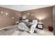 Spacious bedroom features a large bed, modern décor and an accent wall with unique mirrors at 4213 Essex Green Ct, Las Vegas, NV 89110