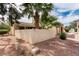 Exterior view of a charming home showcasing desert landscaping and architectural details at 4213 Essex Green Ct, Las Vegas, NV 89110