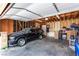 Spacious garage with storage, work area and vehicle at 4213 Essex Green Ct, Las Vegas, NV 89110