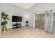 Bright living room featuring tiled floors, sliding glass doors and ample space at 4213 Essex Green Ct, Las Vegas, NV 89110