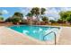 Resort-style pool with crystal-clear water and well-maintained deck at 4213 Essex Green Ct, Las Vegas, NV 89110