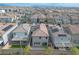Residential aerial showcasing home exteriors with solar panels, landscaped yards, and desert surroundings at 4589 Swimming Minnow Ave, Las Vegas, NV 89141