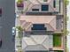 Overhead aerial of rooftops, showing solar panels, and backyards with desert landscaping in a suburban neighborhood at 4589 Swimming Minnow Ave, Las Vegas, NV 89141