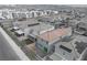 An aerial view of a residential community with homes featuring solar panels and backyard patios at 4589 Swimming Minnow Ave, Las Vegas, NV 89141