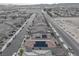 Aerial view of the neighborhood with solar panels on the roof of a home at 4589 Swimming Minnow Ave, Las Vegas, NV 89141