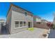 The backyard features a brick patio, small lawn, and secure fencing for outdoor enjoyment at 4589 Swimming Minnow Ave, Las Vegas, NV 89141