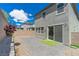The backyard features a brick patio, small lawn, and secure fencing for outdoor enjoyment at 4589 Swimming Minnow Ave, Las Vegas, NV 89141