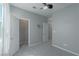 Bedroom with gray walls, soft carpet and a door leading to a walk-in closet at 4589 Swimming Minnow Ave, Las Vegas, NV 89141