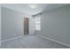 Bedroom with light gray walls, soft carpet and a door leading to a walk-in closet at 4589 Swimming Minnow Ave, Las Vegas, NV 89141