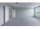 The empty bedroom has neutral carpet, one sunny window, and ample space to make it your own at 4589 Swimming Minnow Ave, Las Vegas, NV 89141