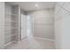 Walk-in closet with shelving and space for storage, leading to additional rooms at 4589 Swimming Minnow Ave, Las Vegas, NV 89141